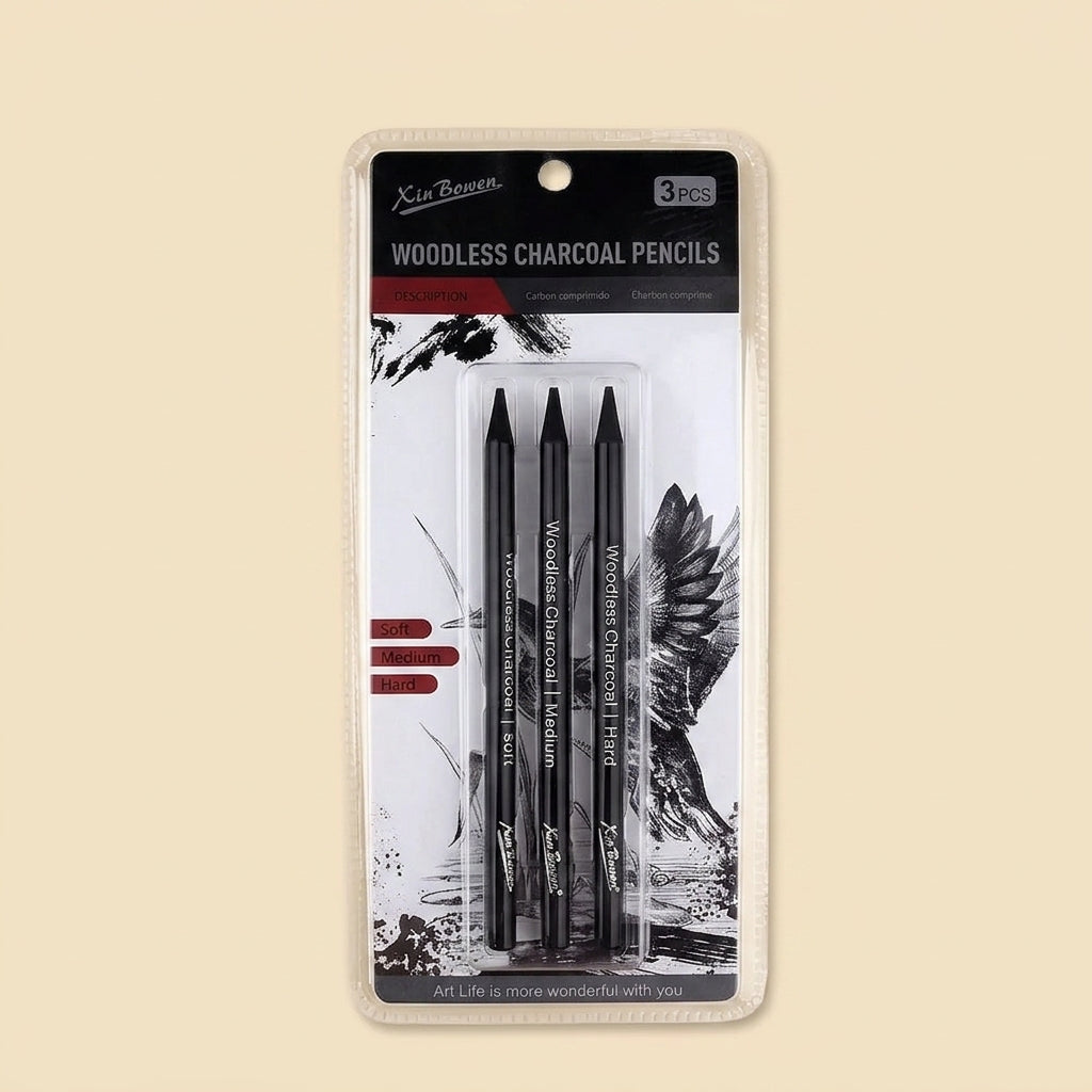 3-pack of Xin Bowen woodless charcoal pencils in black, shown in original retail blister packaging against a beige background
