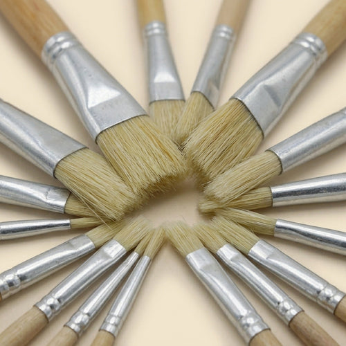 Close-up of bristle paint brush tips arranged in a radial star pattern

