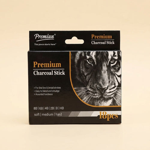 A package of Premium Charcoal Stick, 18 pieces, featuring a black box with a detailed tiger illustration and gold and white text, set against a solid beige background.
