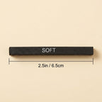 A black rectangular bar labeled 'SOFT' with dimension lines and text indicating a length of 2.5in / 6.