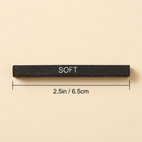A black rectangular bar labeled 'SOFT' with dimension lines and text indicating a length of 2.5in / 6.