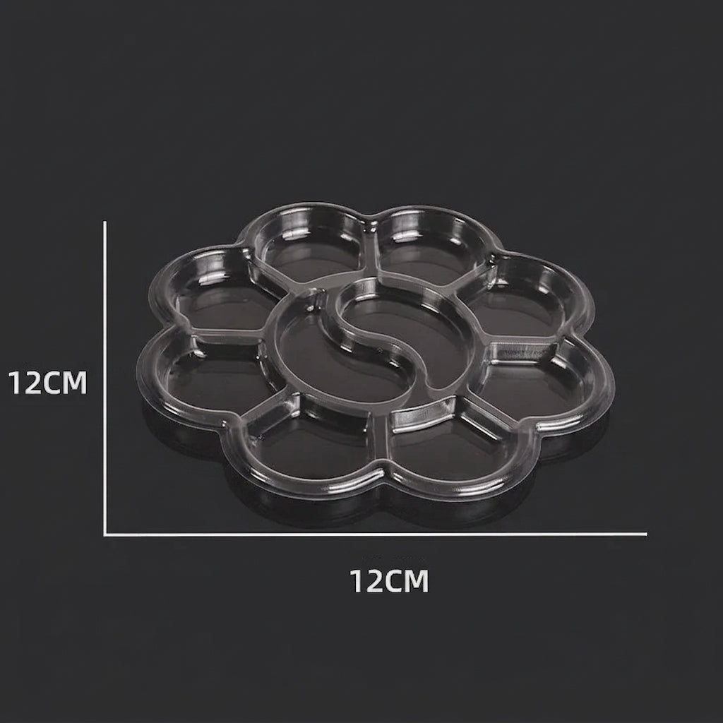 A clear plastic flower-shaped tray with multiple circular compartments, shown on a dark background with white dimension lines indicating 12CM by 12CM measurements.