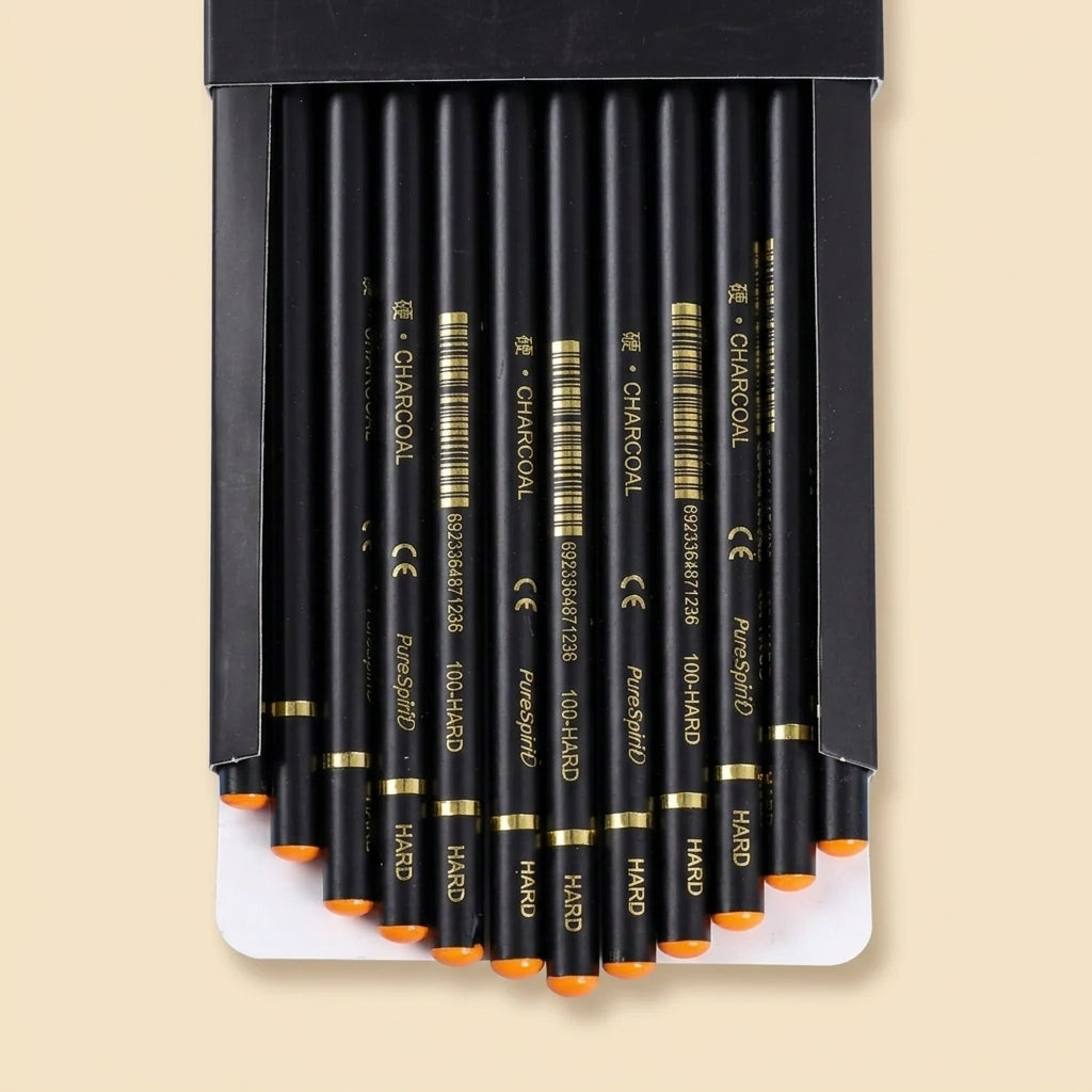 12 Hard-grade charcoal pencils fanned out in open box