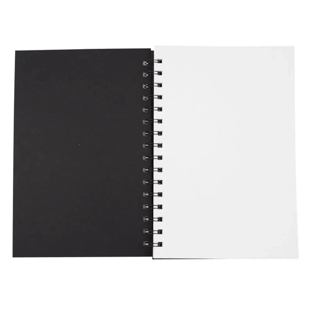 Black spiral-bound sketchpad with white pages on a white background