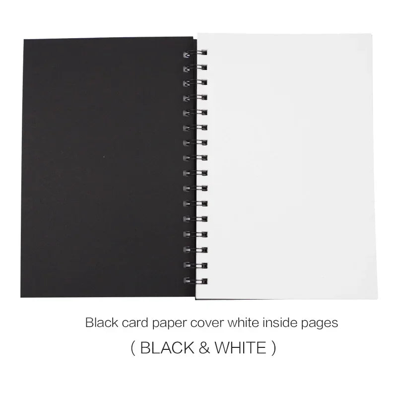 A spiral-bound sketchpad or card album shown open, with a black cover on the left and white interior pages on the right. Text below reads 'Black card paper cover white inside pages ( BLACK & WHITE )'.