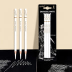 Three Xin Bowen white charcoal pencils standing upright beside their retail blister pack, on a beige and black background
